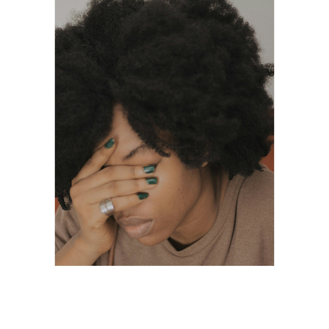 Black woman experiencing burnout and emotional fatigue, illustrating recovery and self-care for Black women over 40.