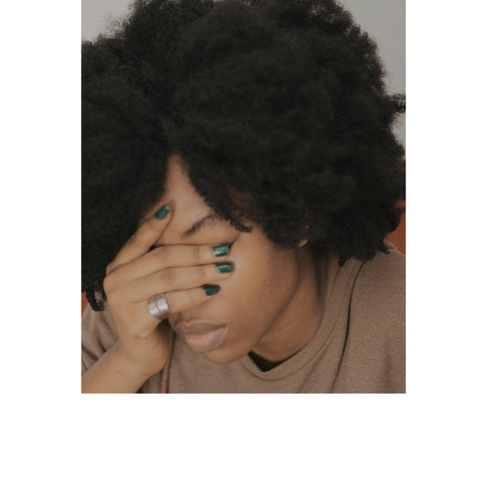 Black woman experiencing burnout and emotional fatigue, illustrating recovery and self-care for Black women over 40.