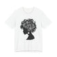 Black woman floral silhouette t-shirt worn by mature woman in blazer, lightweight cotton graphic tee with intricate natural hair floral design