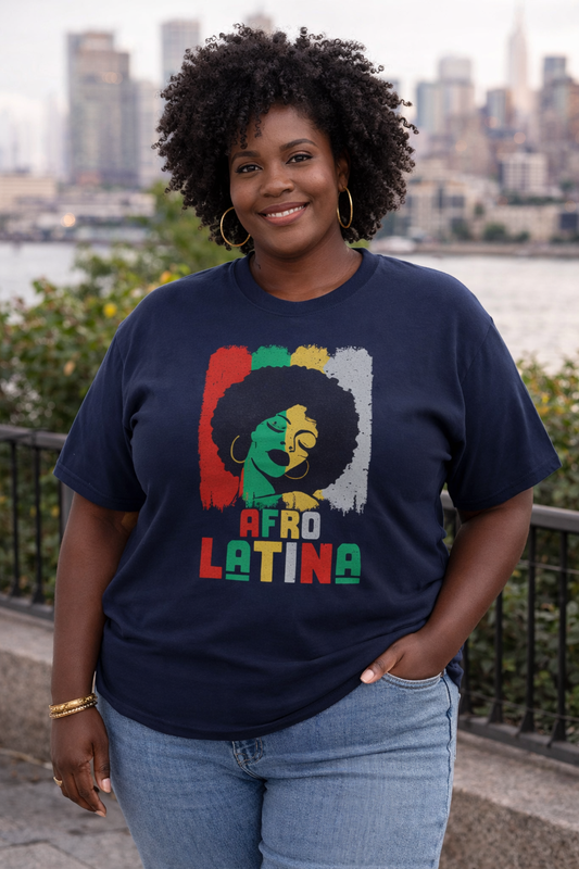 Plus size Black woman in her 40s wearing a navy Afro Latina graphic t-shirt with bold red, green, and yellow afro art design.